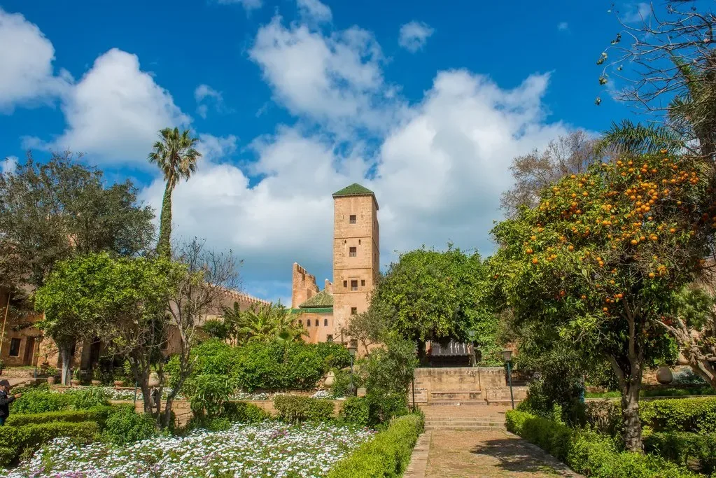 Garden near the Koutoubia in Marrakech with palm trees and historic minaret