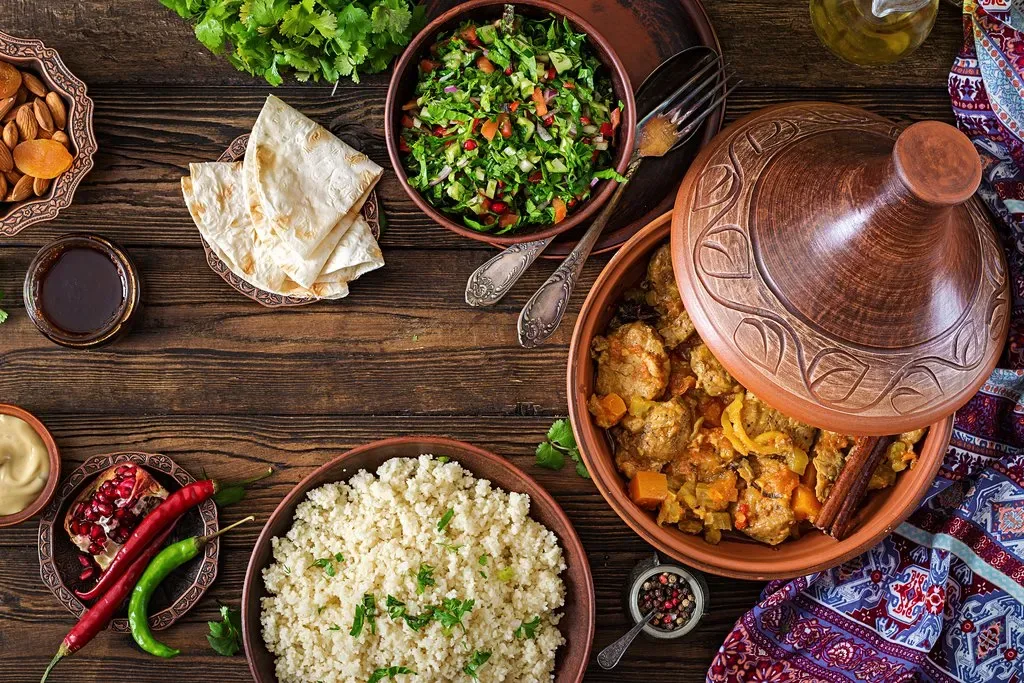 Traditional Moroccan food served in Marrakech with tagine, couscous and salads