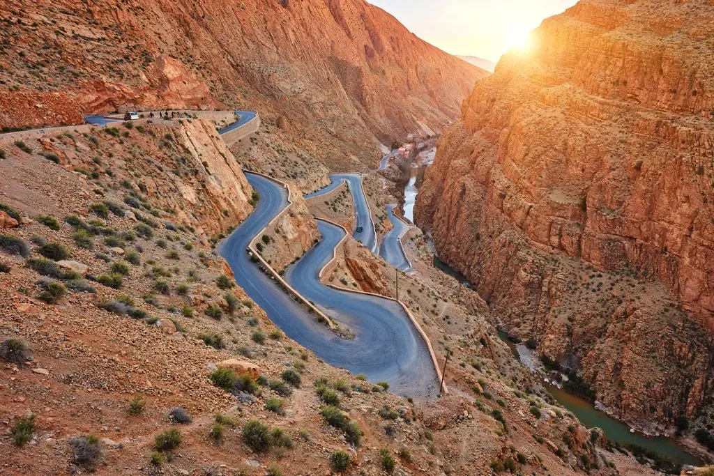 Winding road through a rocky Moroccan gorge illustrating changing landscapes on an October road trip