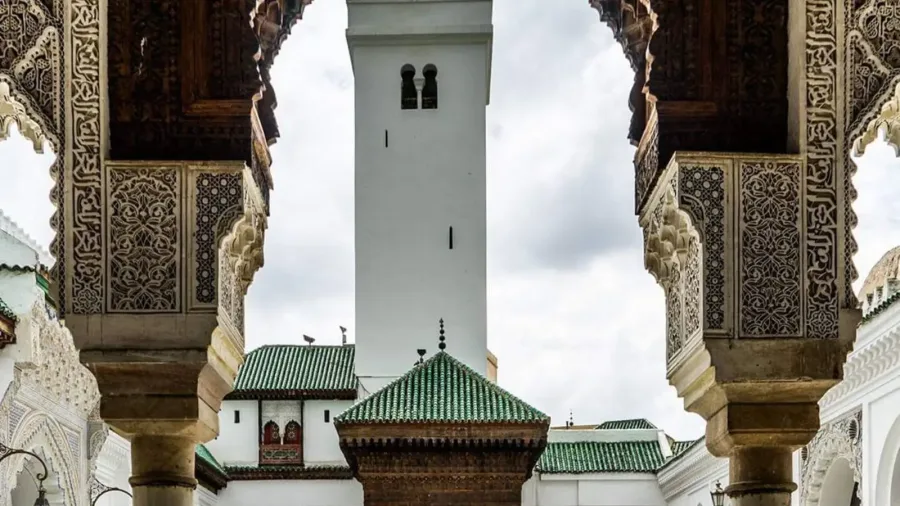 Marble courtyard, fountain and decorated arcades at Al Quaraouiyine in Fes