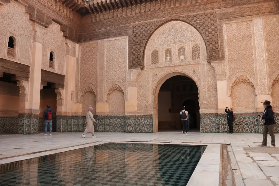 Ornate central courtyard of Ben Youssef Madrasa in Marrakech