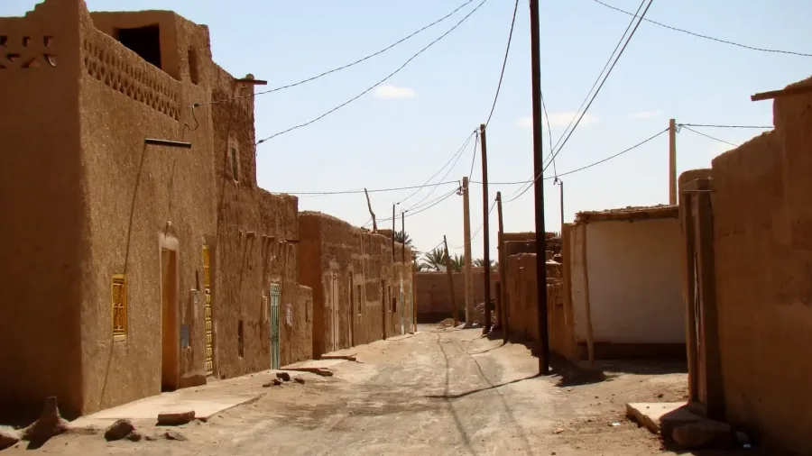 Earthen village street in Merzouga Morocco